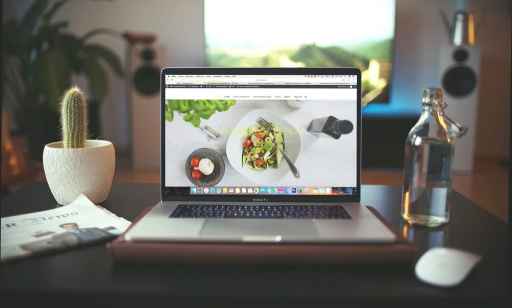 a laptop is placed on the working table