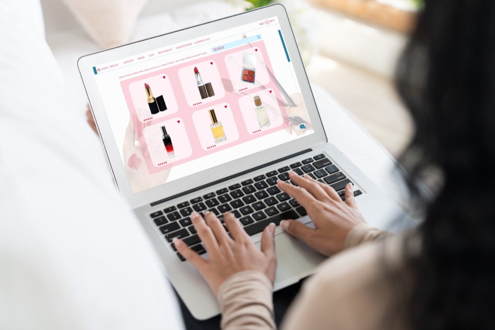 a woman is search products on online store