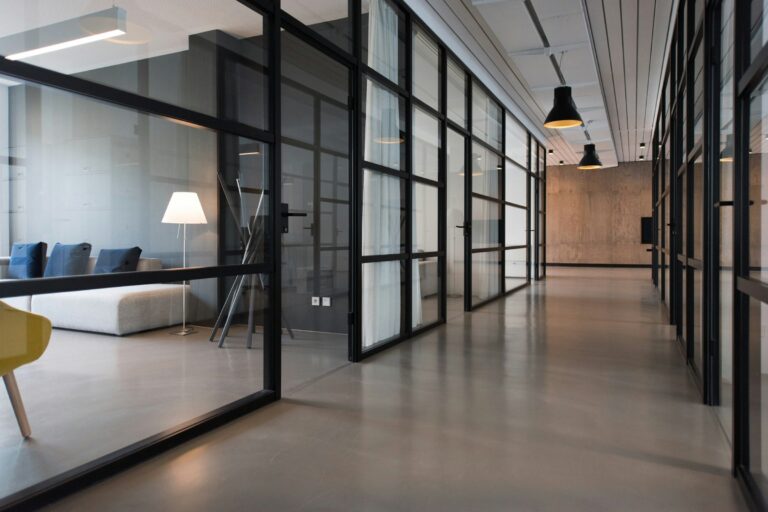 Open office workspace with laptops, used as a landscape featured image for a WordPress article.