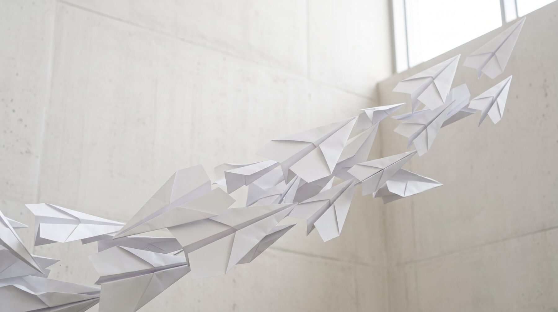 Abstract white folded paper planes — placeholder image
