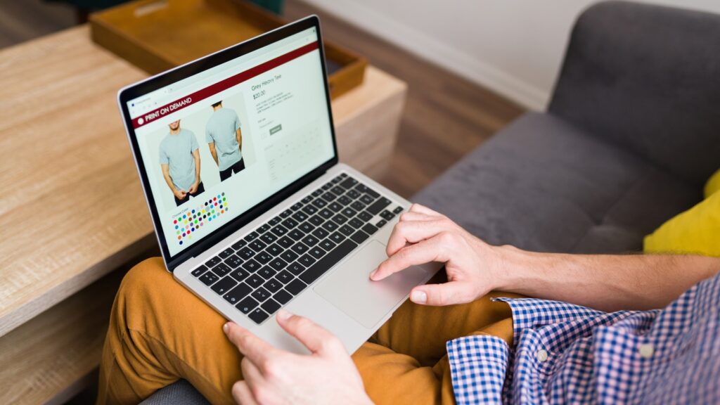 Person using a laptop to customise a product in an online store