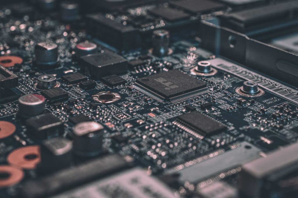Close-up of a black computer circuit board and chip.